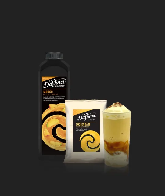 DaVinci Gourmet Mango beverage bottle with a Cooler Base packet and a layered mango swirl iced drink on a dark background.